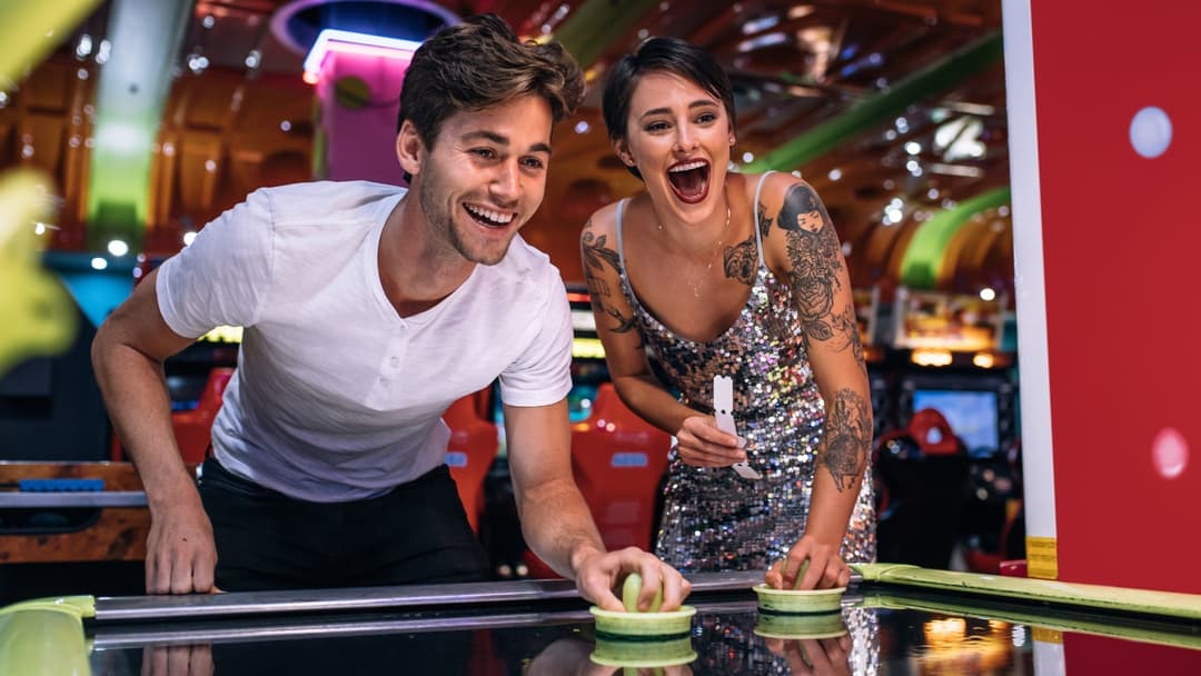 Man and woman on a date in the arcade at O’Learys.